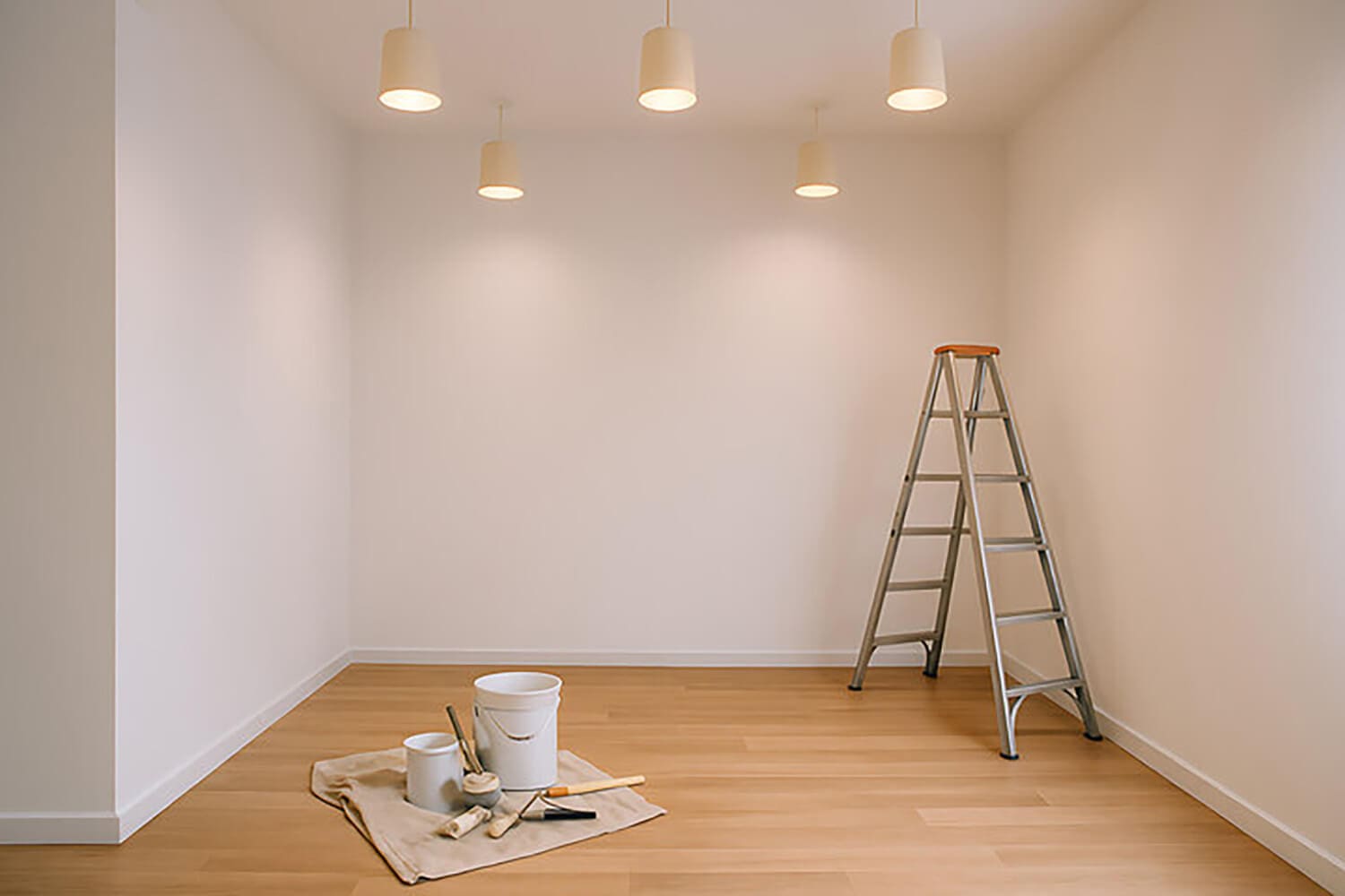 How to plan an interior painting project with a prepared room, paint supplies, and ladder ready for professional interior painting work